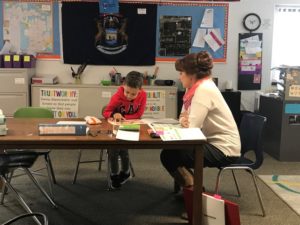 Vonda sitting with Student during the 2019-2020 school year