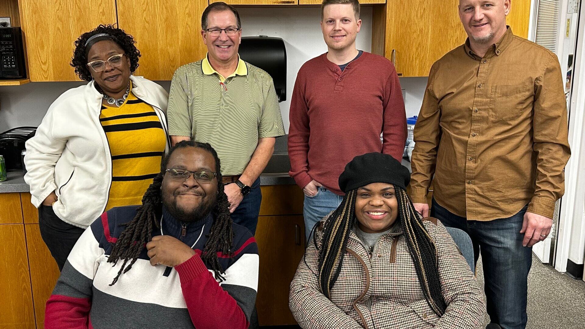 New Branches Charter Academy school board poses for a picture in their office together.