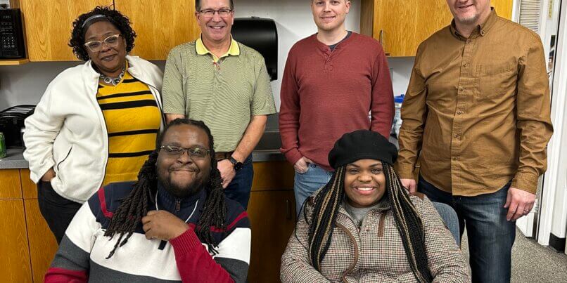 New Branches Charter Academy school board poses for a picture in their office together.