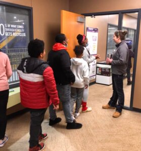 New Branches Charter Academy students speak with Kent County Recycling Center Recycling Directors as well as Education Specialists to learn new recycling efforts and strategies.