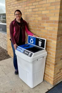 NBCA staff tend to recycling bins posted around the perimeter of the school to ensure that plastic and cans among other resources get recycled.